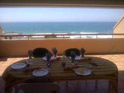 Spectacular sea views from spacious balcony equipped with built-in braai