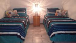 Second bedroom with two single beds and a built-in wardrobe