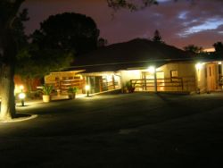 Night view of Dempsey's Guest House