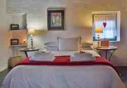 Sakkie's spacious bedroom. White linen and towels.