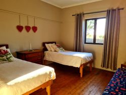 Second room with two single beds