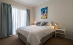 Guest bedroom with door to all around patio and fresh ocean air