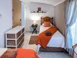 Unit 1 - family unit 
Smaller bedroom with 2 single beds - walking out of main bedroom