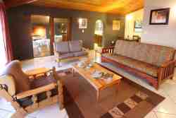 Open plan lounge and dining room area overlooking Rondevlei and the majestic Outeniqua Mountain Range
