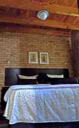 Guests choose between 2 single beds and a king size bed.  This is a king size bed.
