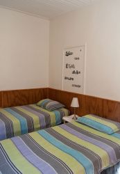 You can choose between a double bed or single beds for your private room!