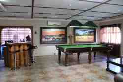 entertainment area with free pool table, Big screen and bar