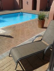 self cater unit with sliding door to outside pool are
