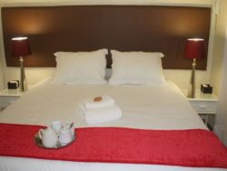The big king size bed in Country Cottage is spacious and comfy.