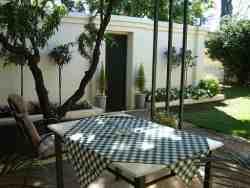 Entertaining area with Braai .Far right is entrance to under roof parking for 2 cars
This cottage sleeps 5 