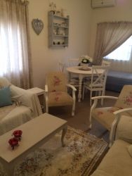 Lounge with dining area and extra bed for 5th person