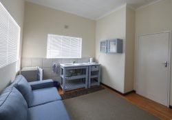 Cottage # 6 Ottello with en suite king room and living area, with sleeper couch.