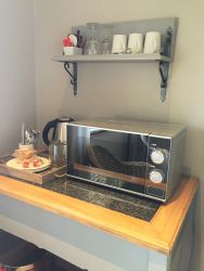 Coffee station with kettle, microwave and fridge available in all rooms