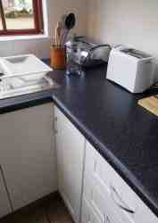 The studio unit kitchenette is fully equipped.