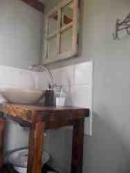 One of the two bathrooms, both of which have showers.