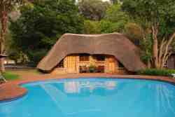 Thatched Rooms 7 & 8 at Swimming Pool