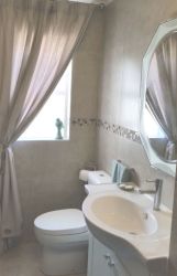 En-suite bathroom with shower.
