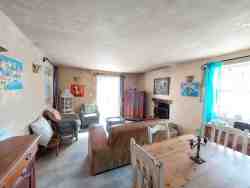Hocus Pocus open plan living and kitchen area with an inside fireplace.