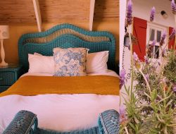 Hocus Pocus main double bed bedroom upstairs with a view from the outside terrace