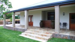 Garden and underroof parking in background
