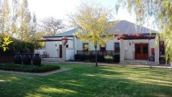 Spacious garden with Blue Crane room in background