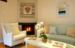 Cosy fire place for the cooler evenings, tastefully decorated with attention to detail and lots of love
