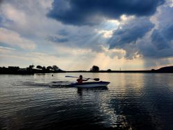 Guests canoeing on dam