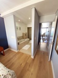 Ensuite bathroom. Passage on the right leads to kitchen/living area