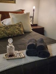Room 7 bed and decanter close up 