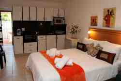 private unit two ,open plan fully equipped ,has a double and single bed ,dinning and lounging area  own courtyard ,parking in front of unit .