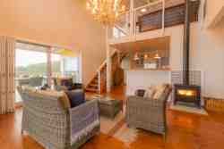 Lounge with indoor fireplace and sea views