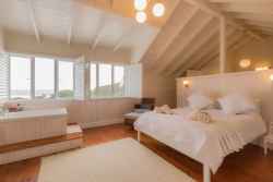 Main bedroom upstairs with full sea views and en-suite