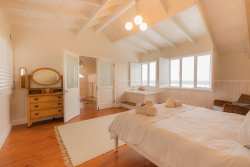 Main bedroom upstairs with full sea views and en-suite