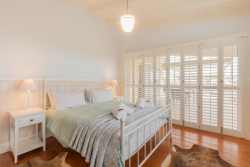 Downstairs bedroom with en-suite bathroom and full sea views