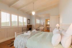 Downstairs bedroom with en-suite bathroom and full sea views