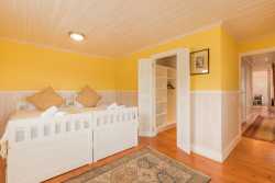 Downstairs bedroom with private sea-facing deck and walk-in closet and adjacent bathroom