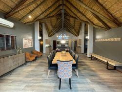 Inside dining area with open plan kitchen