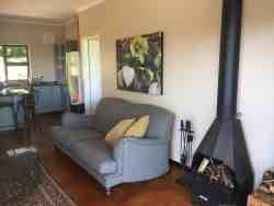 Two Bedroom Cottage - Sitting area with fireplace