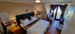 Room 2 , upstairs with king size bed & private balcony