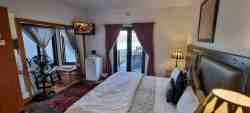 Room 3, ground level with double bed and access to the main balcony for beautiful sunsets
