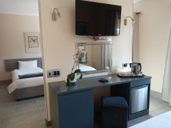 Twelve Apostle's Room - Desk and fridge