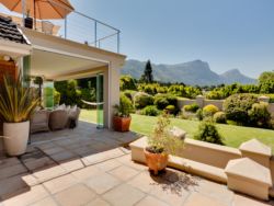 Enclosed patio opening up onto the front garden