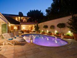 Pool and entertainment area lit up at night