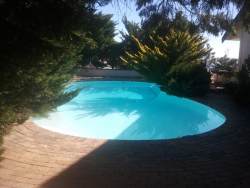 Shared pool & under cover parking in an open garage