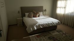 Downstairs bedroom with king size bed.