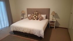 Downstairs bedroom with king size bed.