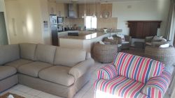Upstairs open plan lounge and fully equipped kitchen.