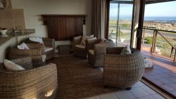 Second smaller seating area upstairs with build-in braai or fire place.
