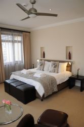Carpeted Executive Suite with Jacuzzi Bath and Multi-head Shower En-Suite. Aircon and Ceiling Fan. Mini bar-fridge.