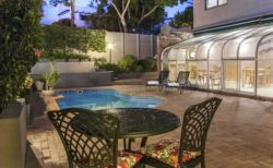 Evening ambience, from a private patio looking onto pool and breakfast room